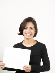 Naklejka premium Beautiful young woman holding a blank sheet of paper