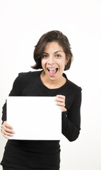 Naklejka premium Beautiful young woman holding a blank sheet of paper