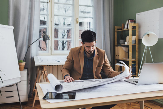 Architect Reading a Blueprint