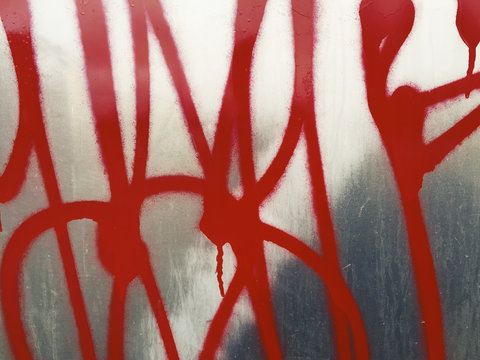 Colorful graffiti markings on metallic wall, close up