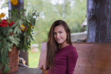 beautiful girl in red dress in the greenhouse