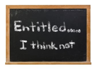 Entitled, I think not written in white chalk on a black chalkboard isolated on white