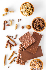 Ingredients for chocolates on white background top view