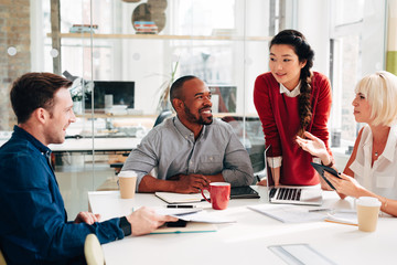 Business meeting at work at trendy startup company discussing planning strategy for growth and development