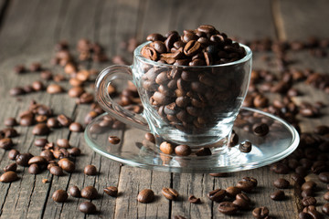 A white set of coffee on wooden and sacking background with cinnamon and coffee beans