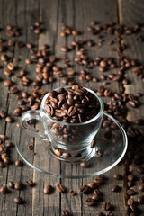 A white set of coffee on wooden and sacking background with cinnamon and coffee beans