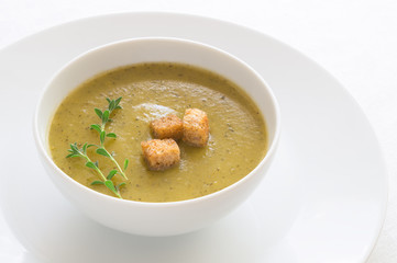 croutons and thyme on vegetarian soup puree