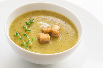 vegetable soup puree decorated with croutons and thyme