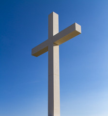 Cross under blue sky