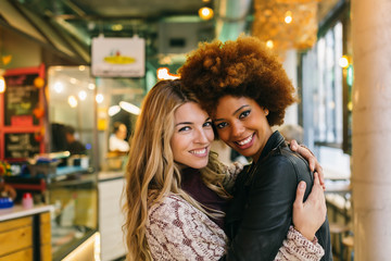 Multi-ethnic Couple Hugging in a Traditional Market
