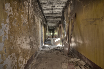 Abandoned building.A dark corridor in a ruined building