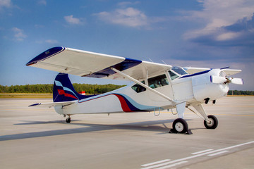Duster, small old plane for agricultural spraying, flying in the sky
