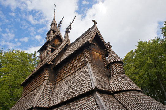 Fantoft Stavkirke - wooden church near Bergen, Norway, surrounded by trees, viking architecture