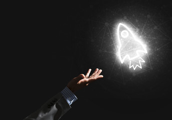 Fototapeta premium Man palm presenting Rocket web icon as technology concept