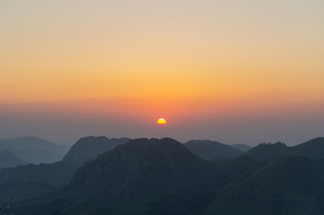 Silhouettes of mountains at sunset