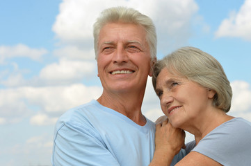 senior couple hugging outdoors