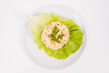 Vegetable salad (potato, carrot, corn, pea, egg, leek) with mayonnaise on a white background