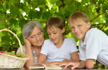 senior woman with two boys 