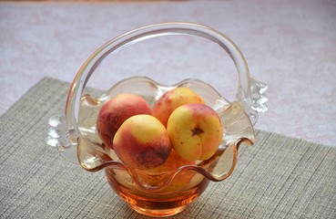 nectarines and peaches in backet. peach, nectarine cut in half stone