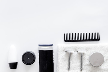 Men's shaving. Tools and cosmetics on white background top view copyspace