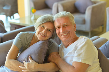 old couple sitting on sofa 