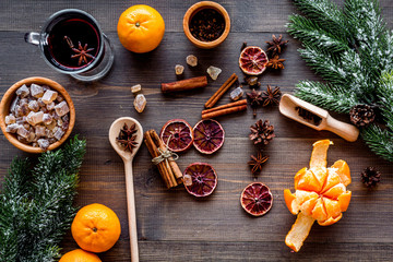 Ingredients mulled wine, grog with spices and citrus for winter evening. Christmas new year eve. Wooden background top view.