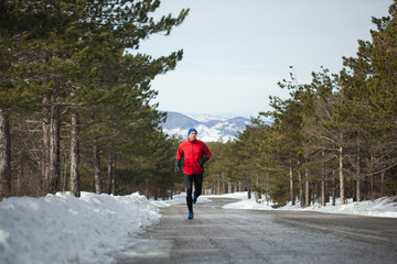 Running on a mountain road during the winter day