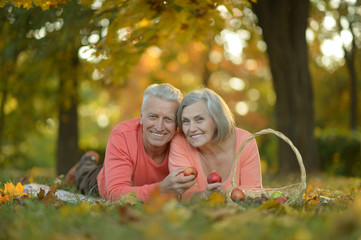 couple posing in autumn park 