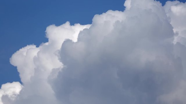 Clouds time lapse. Fluffy white with blue sky.