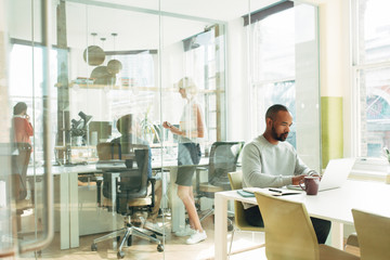 Business people working in busy office space