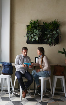 Young entrepeneurs working at a cafe