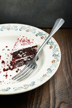 A single slice of cake on a plate