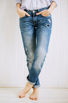 Woman wearing jeans. Crop shot.