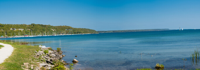 Panorama of the lake with yachts on the quay