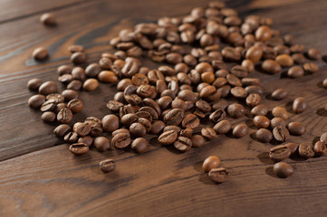 Coffee beans on a wooden background