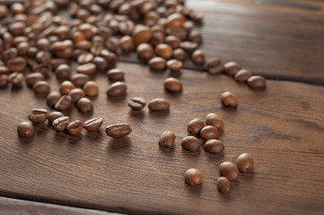 Coffee beans on a wooden background