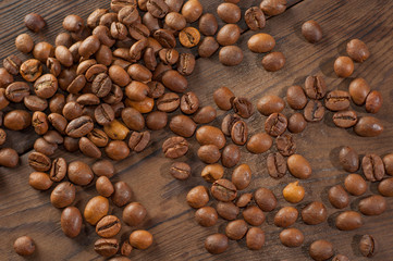 Coffee beans on a wooden background