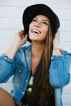 Cute and trendy young woman smiling