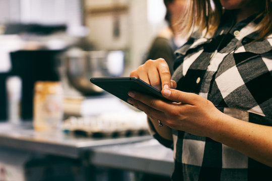 Bakery: Baker Using Digital Tablet To Check Recipe