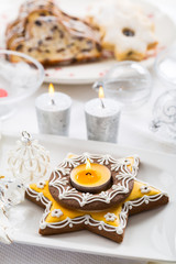 Fototapeta na wymiar Decorated Christmas table with gingerbread candle