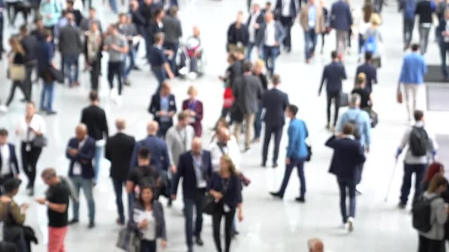 Blurred people at a trade fair