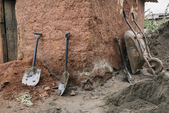 Dirty shovels and wheel barrow in Africa