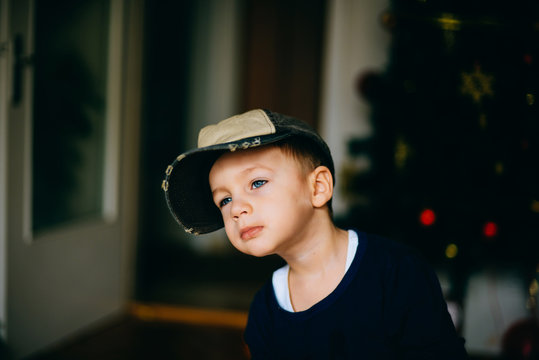 Boy is plaing with the cap