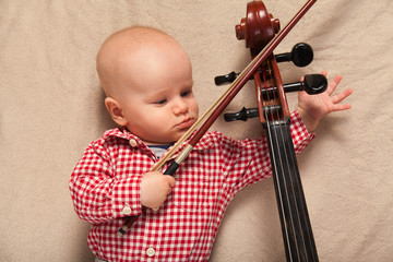 Child boy with cello
