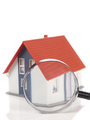 House and magnifying glass