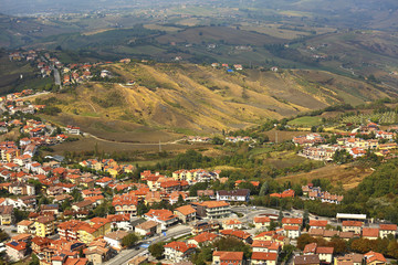 Fototapeta na wymiar Beautiful landscape of mountains and rural town under blue sky from high view of San Marino city
