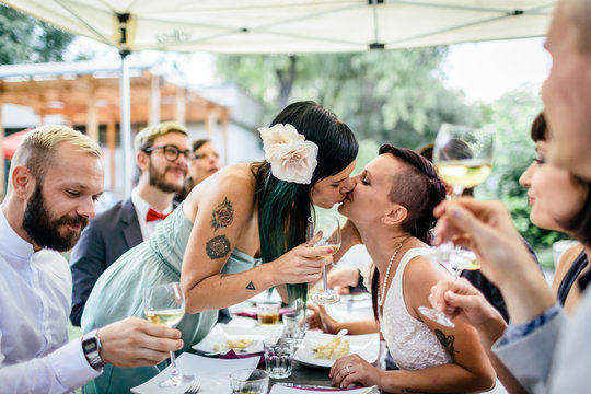 Couple kissing at wedding party