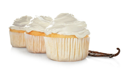 Tasty vanilla cupcakes on white background