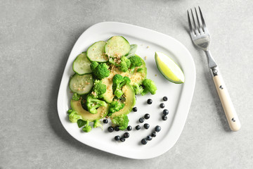 Plate with superfood salad on table