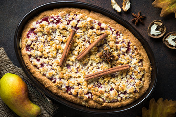 Autumn pie crumble with fruit ginger and spices. Top view.